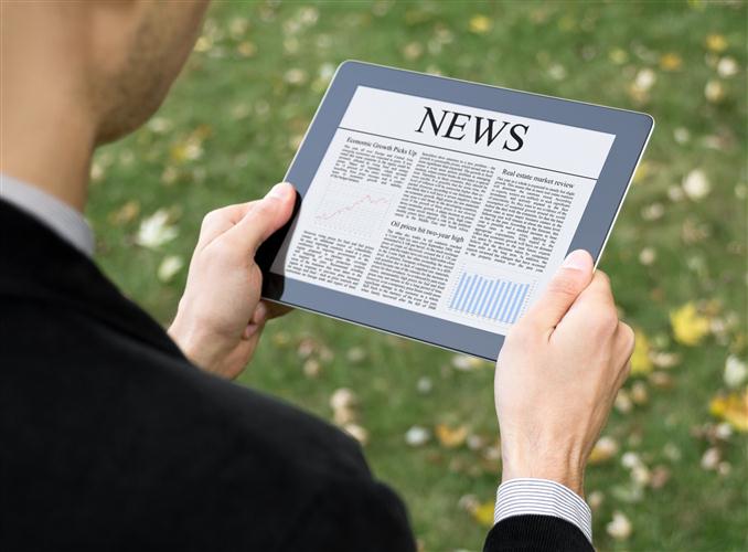 news-tablet-reading-newspaper-ipad-read-business-custom.jpg